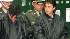 ===CORRECTED CAPTION=== BOG07 - 19991013 - BOGOTA, COLOMBIA : Colombian drug kingpins Fabio Ochoa Vasquez (R) and Ever Villafane, (L), arrested in the drug sting "Operation Millennium", are presented to the press 13 October, 1999, in Bogota, along with 28 other suspects. The operation involved the Colombian police, the US Drug Enforcement Agency, the CIA and other Colombian security forces and was carried out in Mexico, Ecuador, the US and Colombia. (ELECTRONIC IMAGE) EPA PHOTO AFP/MARCELO SALINAS