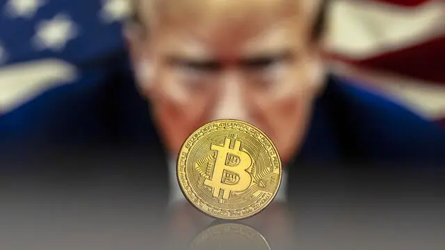 epa11734555 An illustration shows a symbolic Bitcoin in front of an image depicting US President-elect Donald Trump, in Lugano, Switzerland, 22 November 2024. The world's most popular cryptocurrency hit a record high on 21 November, approaching the 100,000 US dollar (USD) mark. Bitcoin has been regularly hitting fresh records this month on hopes that US President-elect Donald Trump will usher in a golden age of cryptocurrencies. EPA/PABLO GIANINAZZI