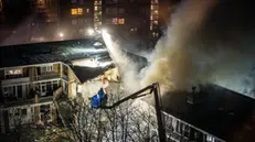 epa11761568 Emergency services try to extinguish a fire after a fire and an explosion at a residential building, in The Hague, the Netherlands, 07 December 2024. The explosion blew away several apartments. EPA/JOSH WALET