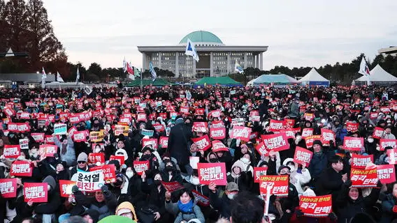 epa11763949 Rally participants call for the impeachment of President Yoon Suk Yeol in front of the National Assembly in Seoul, South Korea, 07 December 2024 (issued 08 December 2024). President Yoon survived an opposition-led motion on 07 December, that sought to impeach him for his short-lived declaration of martial law, as it did not meet the required quorum after governing party lawmakers boycotted the vote. EPA/YONHAP SOUTH KOREA OUT