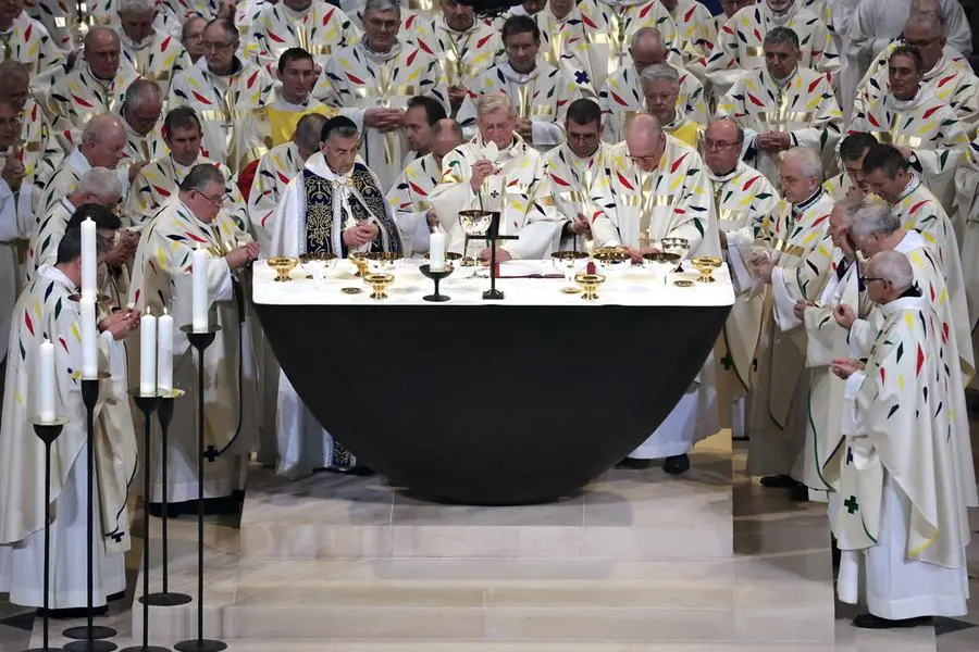 epaselect epa11764419 Paris' archbishop Laurent Ulrich celebrates the first mass at the Notre Dame de Paris Cathedral in Paris, France, 08 December 2024. The Notre Dame de Paris Cathedral reopened on 07 December after nearly six years of renovation work following its destruction by a fire on 15 April 2019. EPA/CHRISTOPHE PETIT TESSON / POOL