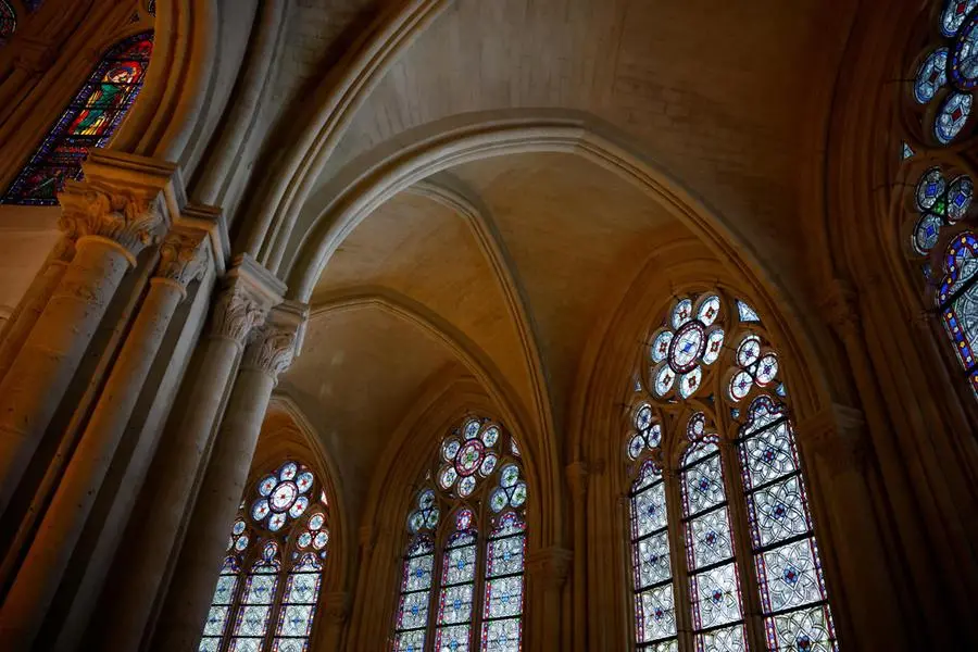 epa11764302 View of the stained glass windows during the inaugural Mass, with the consecration of the high altar, at the Notre-Dame de Paris Cathedral in Paris, France, 08 December 2024. The Notre Dame de Paris Cathedral reopened on 07 December after nearly six years of renovation work following its destruction by a fire on 15 April 2019. EPA/SARAH MEYSSONNIER / POOL MAXPPP OUT