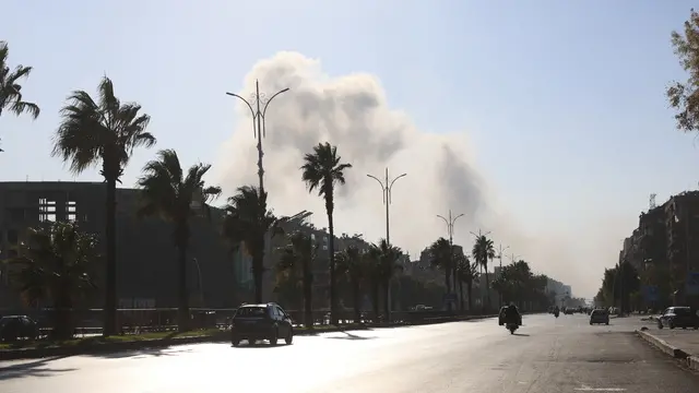 epa11765254 Smoke rises in central Damascus, Syria, 08 December 2024. Syrian rebels entered Damascus on 08 December 2024 and announced in a televised statement the 'Liberation of the city of Damascus and the overthrow of Bashar al-Assad,' as well as the release of all the prisoners. The rebels also urged the Syrian armed forces to leave Syrian public institutions, which will stay under the control of the outgoing Syrian prime minister until the official handover ceremony. EPA/MOHAMMED AL RIFAI