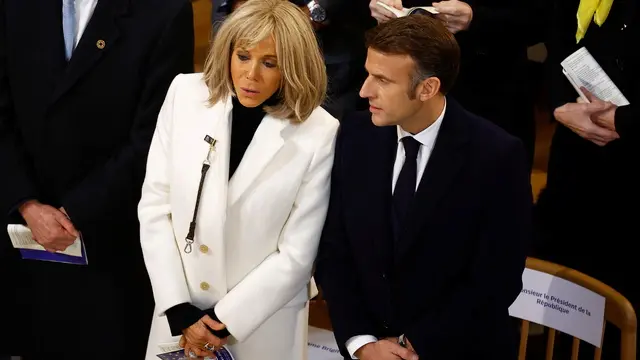 epa11764502 French President Emmanuel Macron and his wife Brigitte Macron attend the inaugural Mass, with the consecration of the high altar, at the Notre-Dame de Paris Cathedral in Paris, France, 08 December 2024. The Notre Dame de Paris Cathedral reopened on 07 December after nearly six years of renovation work following its destruction by a fire on 15 April 2019. EPA/SARAH MEYSSONNIER / POOL MAXPPP OUT