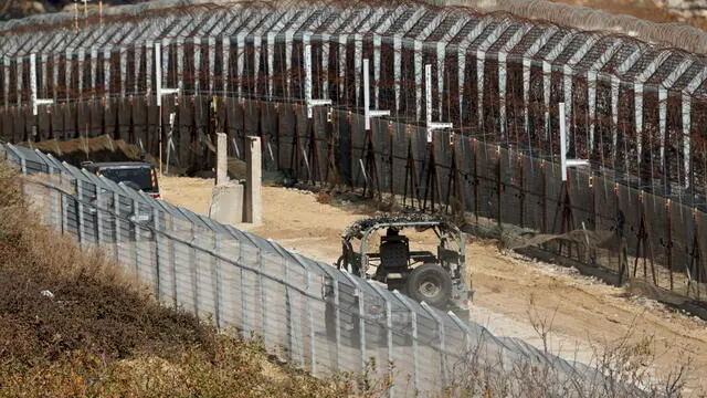 epa11766103 Israeli troops at the border with Syria near the Druze village of Majdal Shams, in the Israeli-annexed Golan Heights, 09 December 2024. The Israeli army announced it has deployed forces to strengthen the defense of the Golan Heights and the eastern Israeli border with Syria. Syrian rebels entered Damascus on 08 December 2024 and announced in a televised statement the 'Liberation of the city of Damascus and the overthrow of Bashar al-Assad', as well as the release of all the prisoners. EPA/ATEF SAFADI