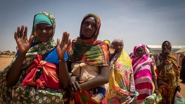 epa11275410 Refugee women from West Darfur wait to get a pack of food for four days from workers of the World Food Programme (WFP) and Red Cross, in a refugee camp in Adre, Chad, on the border with Sudan, 12 April 2024. Most of the refugees are women and children fleeing the hunger crisis because of the war which started on 15 April 2023. According to the UNHCR in March 2024, in one year more than 500,00 Sudanese refugees, mainly from Darfur region, have crossed into Chad looking for safety, 90 percent of them are women and children. As different humanitarian crises are unfolding in other parts of the world, both the UN and NGOs like Doctors Without Borders/MÃ©decins Sans FrontiÃ¨res (MSF) keep appealing for more aid to reach Sudan and avoid a looming famine situation in the already strained socio-economic context of Chad. EPA/STRINGER