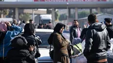 epa11766499 Syrians wait to cross into Syria from Turkey at the Cilvegozu Border Gate in Reyhanli district of Hatay, Turkey, 09 December 2024. On 09 December 2024, the Political Affairs Department of the Syrian Salvation government called for all refugees outside Syria to return. Syrian rebels entered Damascus on 08 December 2024 and announced in a televised statement the 'Liberation of the city of Damascus and the overthrow of Bashar al-Assad,' as well as the release of all the prisoners. The rebels also urged the Syrian armed forces to leave Syrian public institutions, which will stay under the control of the outgoing Syrian prime minister until the official handover ceremony. EPA/KAZIM KIZIL