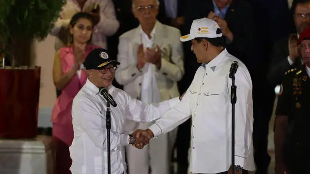 epa11268596 The president of Colombia, Gustavo Petro (L), poses with the president of Venezuela, Nicolas Maduro, after a meeting at the Miraflores Palace, in Caracas, Venezuela, on 09 April 2024. The meeting was cordially held despite the recent criticism by Petro on the elections process in Venezuela, where the principal opposition leader has been unable to register. EPA/Rayner Pena R.