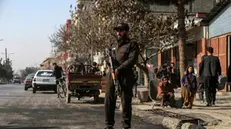 epa11062205 Taliban security personnel stand guard at the scene of a blast that hit a minibus in Kabul, Afghanistan, 07 January 2024. A bomb blast in Kabul's Dasht-e-Barchi neighborhood killed two civilians and wounded 14 others on 06 January, with suspicions falling on the Islamic State-Khorasan (IS-K) group, police said. The area has been a target for deadly militant bombings, particularly targeting Shiite mosques, schools, and hospitals. The Taliban government has claimed a 90 percent decrease in IS-K attacks due to their counterterrorism operations, despite recent reports linking IS-K to twin suicide bombings in Iran. The United States has acknowledged IS-K as a continuing terrorist threat based in Afghanistan. EPA/SAMIULLAH POPAL