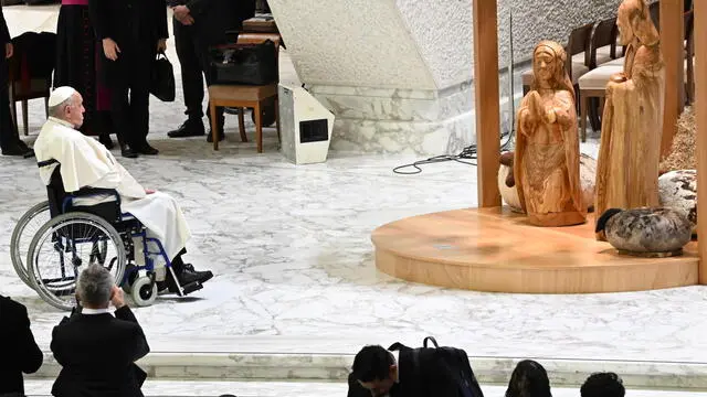 Pope Francis in front of the nativity scene during his weekly general audience, in the Paul VI Hall, at the Vatican, 11 December 2024. ANSA/MAURIZIO BRAMBATTI