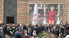 People attend the funeral of Giulia Cecchettin, a university student killed by her ex-boyfriend, one of the country's most recent and shocking episodes of femicide, on December 5, 2023 in Padova. Held at Padua's Basilica of Santa Giustina, the funeral for 22-year-old Giulia Cecchettin attracted thousands of fellow students, public authorities and ordinary Italians in a sign of solidarity for Italy's victims of gender violence. (Photo by ANDREA PATTARO / AFP)