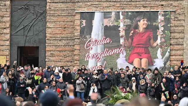 People attend the funeral of Giulia Cecchettin, a university student killed by her ex-boyfriend, one of the country's most recent and shocking episodes of femicide, on December 5, 2023 in Padova. Held at Padua's Basilica of Santa Giustina, the funeral for 22-year-old Giulia Cecchettin attracted thousands of fellow students, public authorities and ordinary Italians in a sign of solidarity for Italy's victims of gender violence. (Photo by ANDREA PATTARO / AFP)