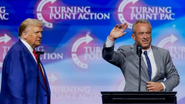 epa11679069 Former US President and Republican presidential nominee Donald Trump (L) and Robert F. Kennedy Jr. (R) at the Turning Point PAC campaign rally at the Gas South Arena, in Duluth, Georgia, USA, 23 October 2024. Trump is running against Democratic US Vice President Kamala Harris. EPA/ERIK S. LESSER