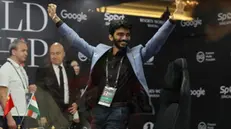 epa11772402 Chess grandmaster Gukesh Dommaraju of India celebrates after winning Game 14 against Ding Liren (not pictured) of China at the FIDE World Chess Championship in Singapore, 12 December 2024. Gukesh Dommaraju became the youngest ever Chess World Champion by beating Ding Liren in the best-of-14-games championships. EPA/HOW HWEE YOUNG