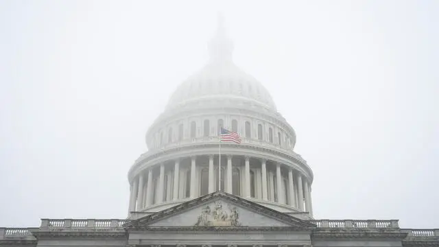 epa11768381 The US Capitol Building is shrouded in fog, in Washington, DC, USA, 10 December 2024. Multiple Trump administration nominees are at the Capitol today visiting with Senators ahead of confirmation hearings next year. EPA/GRAEME SLOAN