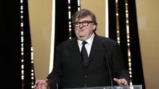 epa07600627 US director Michael Moore speaks onstage during the Closing Awards Ceremony of the 72nd Cannes Film Festival, in Cannes, France, 25 May 2019. The Golden Palm winning movie will be screened after the closing ceremony. EPA/SEBASTIEN NOGIER