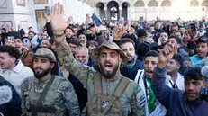 epa11775579 People celebrate inside the Umayyad Mosque, following the overthrow of President Bashar al-Assad by opposition rebels, in Damascus, Syria, 13 December 2024. Hay'at Tahrir Al-Sham (HTS) leader Abu Mohammad Al-Jolani called on people across the country to celebrate 'the victory of the revolution' on 13 December, following the capture of Damascus and the overthrow of Bashar al-Assad on 08 December 2024. EPA/ANTÃ“NIO PEDRO SANTOS