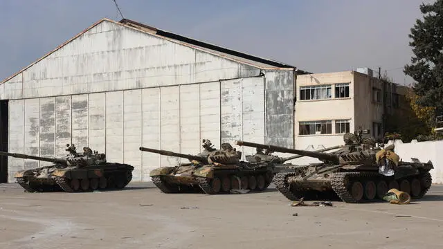 epa11772295 Damaged Syrian government tanks are seen in Mezzeh Military Airport in Damascus, Syria 12 December 2024. The Israeli army stated it has conducted airstrikes across Syria targeting strategic weapons stockpiles. Rebels ousted Syrian president Bashar al-Assad 08 December 2024. EPA/MOHAMMED AL RIFAI