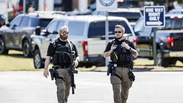 epa11585221 Police officers on the scene of a shooting at Apalachee High School in Winder, Georgia, USA, 04 September 2024. At least four people died and nine injured after a shooting at the school, the Georgia Bureau of Investigation (GBI) announced on social media platform X, formerly Twitter, adding that one suspect was in custody. EPA/ERIK S. LESSER