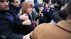 epaselect epa11784898 Gisele Pelicot (C), escorted by her lawyers Stephane Babonneau (L) and policeman arrive at the criminal court where her husband Dominique Pelicot is on trial in Avignon, South of France, 19 December 2024. Judges will hand down verdicts on 51 men in the mass rape trial in which Dominique Pelicot is accused of drugging and raping his then-wife, Gisele Pelicot as well as inviting dozens of men to rape her while she was unconscious at their home in Mazan, France, between 2011 and 2020. EPA/GUILLAUME HORCAJUELO