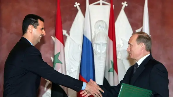 epa11765576 (FILE) - Syrian President Bashar al-Assad (L) and Russian President Vladimir Putin (R) shake hands as they exchange documents during a signing ceremony at the Kremlin in Moscow, Russia, 25 January 2025 (reissued 08 December 2024). According to Russiaâ€™s state-owned news agency TASS quoting Kremlin sources, former Syrian President Bashar al-Assad arrived in Moscow with his family, after receiving â€˜asylumâ€™ in Russia. Syrian rebels entered Damascus on 08 December 2024 and announced in a televised statement the 'Liberation of the city of Damascus and the overthrow of Bashar al-Assad', as well as the release of all the prisoners. The rebels also urged the Syrian armed forces to leave Syrian public institutions, which will stay under the control of the outgoing Syrian prime minister until the official handover ceremony. EPA/SERGEI CHIRIKOV