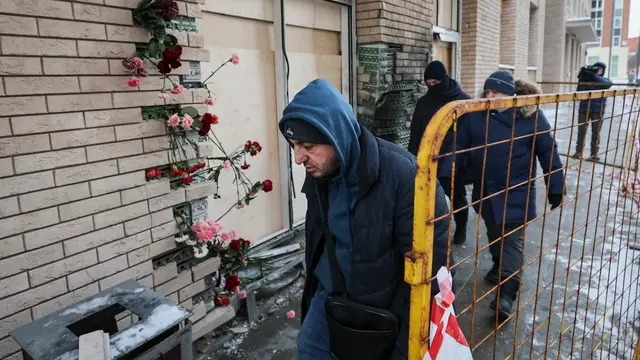 epa11783540 Municipal workers inspect the site where Lieutenant General Igor Kirillov and his assistant were killed in Moscow, Russia, 18 December 2024. According to a statement by the Investigative Committee of Russia, Lieutenant General Igor Kirillov and his assistant were killed in a blast outside of an apartment building in Moscow. The committee's statement said the explosive was hidden inside of an electric scooter.Â EPA/YURI KOCHETKOV