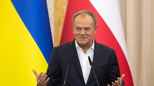 epa11782692 Polish Prime Minister Donald Tusk speaks at a joint press conference with Ukrainian President Volodymyr Zelensky (not seen) after their meeting in the Western Ukrainian city of Lviv, Ukraine, 17 December 2024. Donald Tusk arrived in Western Ukraine with a surprise visit to meet with top Ukrainian officials amid the ongoing Russian invasion. EPA/MAXYM MARUSENKO