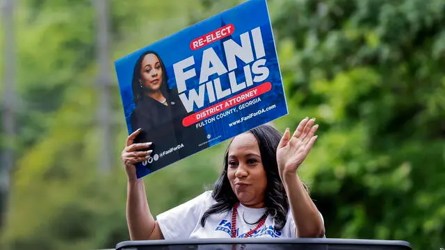 epa11305938 Fulton County District Attorney Fani Willis, who is running for reelection, participates in the parade for the 52nd Inman Park Festival & Tour of Homes in Atlanta, Georgia, USA, 27 April 2024. The popular springtime festival began to bring attention to the revitalization of one of AtlantaÃ•s oldest neighborhoods founded in the late 1800s. EPA/ERIK S. LESSER