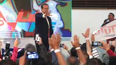 epa11783155 Former Bolivian president Jorge 'Tuto' Quiroga (2001-2002) greets supporters during the presentation of his candidacy for the 2025 elections in La Paz, Bolivia, 17 December 2024. Quiroga announced his presidential candidacy for the 2025 general elections, after withdrawing from an opposition agreement he signed with other leaders to form a unity bloc for those elections. EPA/LUIS GANDARILLAS