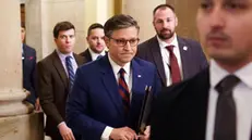 epa11786521 US House Speaker Mike Johnson (C) leaves his office at the US Capitol, in Washington, DC, USA, 19 December 2024. House Republican leadership negotiated a new budget supplemental following the withdrawal of a bipartisan bill designed to fund the US government after opposition from President-elect Trump and Elon Musk. EPA/WILL OLIVER