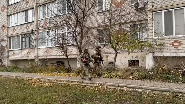 epa11734373 A still image taken from an undated handout video released by the Russian Defence Ministry Press-Service on 22 November 2024 shows Russian military volunteers of the 'Bars-Kursk' formation patrolling in the village of Korenevo, Kursk region, Russia. The 'Bars-Kursk' is a military formation consisting of volunteers from the Kursk region. Fighting between Russian and Ukrainian forces has been ongoing in the Kursk region since 06 August following a Ukrainian military incursion into the Russian border region. EPA/RUSSIAN DEFENCE MINISTRY PRESS SERVICE HANDOUT -- BEST QUALITY AVAILABLE -- MANDATORY CREDIT -- HANDOUT EDITORIAL USE ONLY/NO SALES