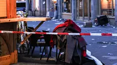 epa11787861 Clothes are piled up at a cordoned off area at the scene of a vehicle-ramming attack on the Christmas market in Magdeburg, Germany, 21 December 2024. According to the Magdeburg police, at least two people were confirmed dead, scores were injured, and the suspect, a Saudi national, was taken into custody after he drove a car into a crowd at Magdeburg' Christmas market on 20 December. EPA/FILIP SINGER