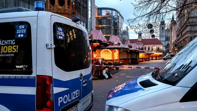 epa11787867 German police vehicles are stationed beside a cordoned off area at the scene of a vehicle-ramming attack on the Christmas market in Magdeburg, Germany, 21 December 2024. According to the Magdeburg police, at least two people were confirmed dead, scores were injured, and the suspect, a Saudi national, was taken into custody after he drove a car into a crowd at Magdeburg' Christmas market on 20 December. EPA/FILIP SINGER