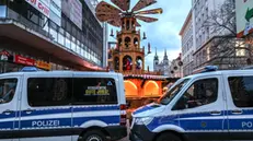 epaselect epa11787862 German police officers sit inside their vehicles as they patrol the scene of a vehicle-ramming attack on the Christmas market in Magdeburg, Germany, 21 December 2024. According to the Magdeburg police, at least two people were confirmed dead, scores were injured, and the suspect, a Saudi national, was taken into custody after he drove a car into a crowd at Magdeburg' Christmas market on 20 December. EPA/FILIP SINGER