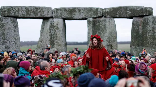 epa11788290 Revellers take part in the winter solstice celebrations at the ancient Stonehenge monument in Wiltshire, Britain, 21 December 2024. The winter solstice, also known as midwinter, marks the day with the shortest period of daylight and the longest night of the year in the northern hemisphere.Â EPA/TOLGA AKMEN