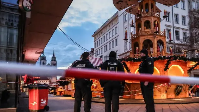 epa11789211 Police patrol next to the Christmas market in Magdeburg, Germany, 22 December 2024. According to Saxony-Anhalt State Premier Haseloff, five people were confirmed dead and at least 200 were injured, after a car was driven into a crowd at Magdeburg's Christmas market on 20 December. The suspect, a Saudi national, was taken into custody. EPA/FILIP SINGER