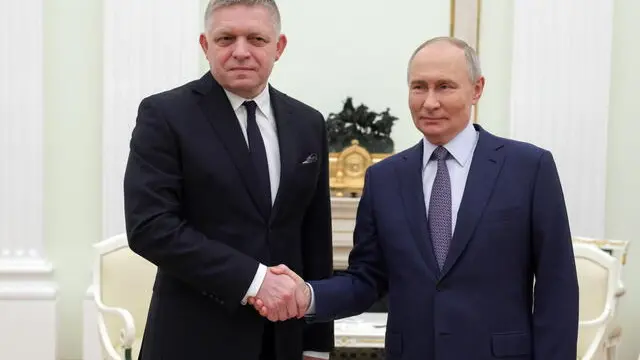 epa11790278 Russian President Vladimir Putin (R) shakes hands with Slovak Prime Minister Robert Fico (L) during their meeting at the Kremlin in Moscow, Russia, 22 December 2024. Fico is on a working visit to Moscow. EPA/GAVRIIL GRIGOROV/SPUTNIK/KREMLIN / POOL