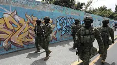 epaselect epa11069797 Ecuadorian soldiers patrol during an operation in the Carapungo neighborhood in Quito, Ecuador, 11 January 2024. Ecuadorian President Daniel Noboa declared on 09 January that government forces were engaged in an 'internal armed conflict' with armed criminal gangs, allowing him to use the army and not just the police to counter the violence, after riots began on 08 January in at least six prisons across the country. Guayaquil, Ecuador's largest city, was the hardest hit by the disturbances. At least 10 people were killed there on 09 January night, two of them police officers, and armed hooded men stormed a television station during a live broadcast. EPA/JOSE JACOME