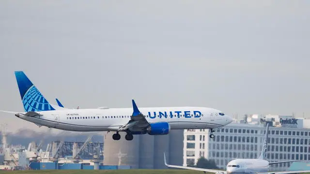 epa11628816 A United Airlines Boeing 737 Max 9 (R) lands as a Copa Airlines Boeing 737-83V (R) waits to depart at Boston Logan International Airport in East Boston, Massachusetts, USA, 27 September 2024. The National Transportation Safety Board (NTSB) issued safety recommendations for some Boeing 737s over concerns about the possible failures in rudder controls, while amidst a two-week strike by 33,000 machinist workers at Boeing. EPA/CJ GUNTHER