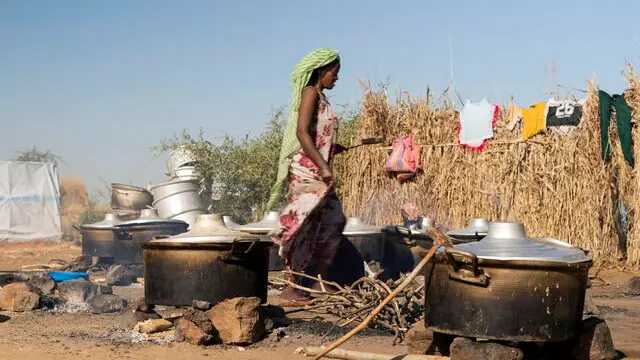 epa08858038 An Ethiopian refugee woman from Tigray region at the Um Rakuba refugee camp, the same camp that hosted Ethiopian refugees during the famine in the 1980s, some 80 kilometers from the Ethiopian-Sudan border in Sudan, 30 November 2020 (issued 02 December 2020). According to World Food Programme on 02 December, about 12,000 Ethiopian refugees from Tigray are accomodated in the Um Rakuba camp as over 40,000 Ethiopian refugees fleed to Sudan since the start of fights in the northern Tigray region of Ethiopia. Ethiopia's military intervention comes after Tigray People's Liberation Front (TPLF) forces allegedly attacked an army base on 03 November 2020 sparking weeks of unrest. According to reports on 02 December 2020, UN reached an agreement with Ethiopian government to provide aid for the Tigray region of Ethiopia. EPA/ALA KHEIR