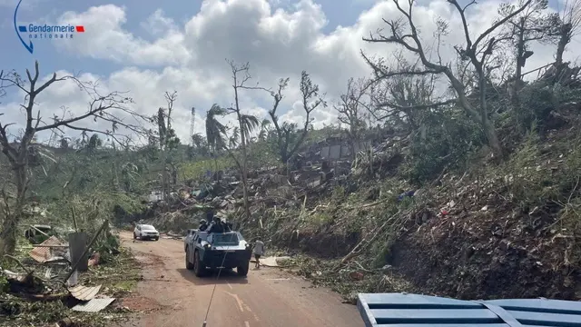 epa11782350 A handout photo made available by the Mayotte Gendarmerie on 17 December 2024 shows a French Gendarmes clearing a road in the French overseas territory of Mayotte, 17 December 2024. Several hundred people may have been killed after tropical cyclone Chido battered the French Indian Ocean territory of Mayotte on 14 December, authorities said. EPA/HANDOUT BEST QUALITY AVAILABLEHANDOUT EDITORIAL USE ONLY/NO SALES