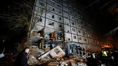 epa11787858 â€‹Ukrainian rescuers work at the site of a drone strike that hit the 9-store residential building in Kharkiv, northeastern Ukraine, 20 November 2024 (issued 21 December 2024). At least eight people, including one child, were injured as a result of drone strikes in the two districts of Kharkiv late 20 December, the State Emergency Service of Ukraine (SESU) reported. Russian troops entered Ukrainian territory on 24 February 2022, starting a conflict that has provoked destruct EPA/SERGEY KOZLOV 72008