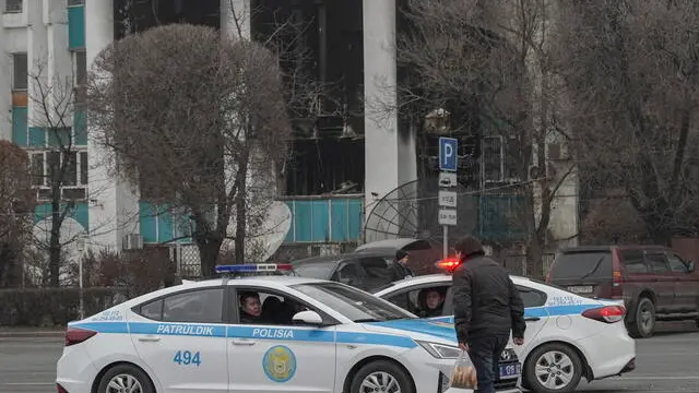 epa09678674 Kazakh policemen guard in downtown of Almaty, Kazakhstan, 11 January 2022. Mass protests in Kazakhstan began in the early days of 2022 - residents of the cities of Zhanaozen and Aktau in the west of the country opposed a twofold increase in prices for liquefied gas. Later, the protests turned into looting, the militants attacked state institutions, took away weapons. The authorities declared a state of emergency across the country until 19 January and launched a counter-terrorism operation. As reported by the Ministry of Health of Kazakhstan, some 164 people where killed during the riots. As a result of the riots, 2,265 people in different regions of the country applied for medical assistance while 83 people remain in serious condition in hospitals of Kazakhstan. EPA/STR