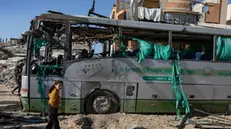 epa11791012 Palestinians inspect a bus hit by an Israeli airstrike in Khan Yunis, southern Gaza Strip, 23 December 2024. At least two people were injured in an Israeli airstrike on a bus in Khan Yunis, according to medics at Nasser Hospital. More than 45,000 Palestinians and over 1,400 Israelis have been killed, according to the Palestinian Health Ministry and the Israeli Army, since Hamas militants launched an attack against Israel from the Gaza Strip on 07 October 2023, and the Israeli operations in Gaza and the West Bank which followed it. EPA/HAITHAM IMAD