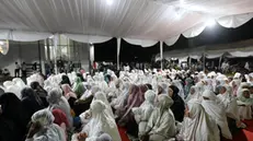 epa11787309 Aceh residents participate in a night of reflection and prayer to commemorate the 20th anniversary of the 2004 Aceh tsunami at the Rahmatullah Mosque in Lampuuk, Aceh Besar, Indonesia, 20 December 2024. This Night of Reflection was organized by the Aceh government. On 26 December 2024, Indonesia marks the 20th anniversary of the 2004 tsunami which was triggered by a 9.2 earthquake in the Indian Ocean off the west coast of northern Sumatra, and killed an estimated 230,000 people in 14 countries. EPA/HOTLI SIMANJUNTAK