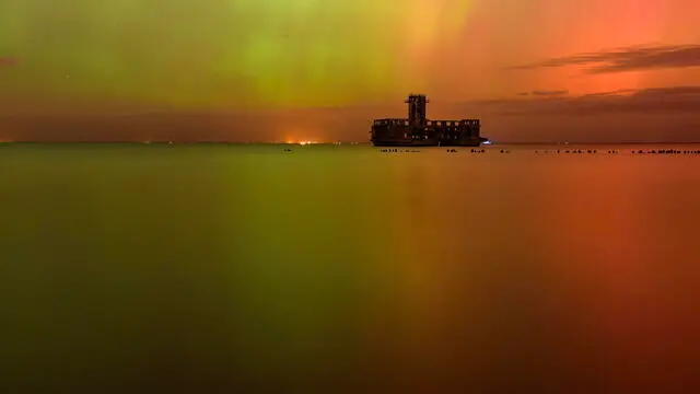 epa11654570 The Aurora Borealis, also known as the Northern Lights, is visible over the Baltic Sea, in Gdynia, northern Poland, 11 October 2024. The northern lights were visible across many parts of the Northern Hemisphere due to a severe geomagnetic storm. EPA/ANDRZEJ JACKOWSKI POLAND OUT