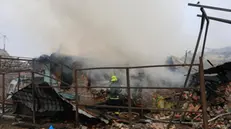 epa11792932 Ukrainian rescuers work at the site of an airstrike on a private building in Kharkiv, northeastern Ukraine, 25 December 2024, amid the Russian invasion. According to the State Emergency Service of Ukraine (SESU), at least six people were injured in the northeastern Ukrainian city of Kharkiv after Russia launched a missile and drone attack across Ukraine on 25 December. EPA/SERGEY KOZLOV