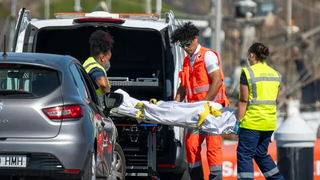 epa11702893 Medical team transpot one of the two bodies of migrants recovered off Lanzarote coast, in Arrecife, Lanzarote, Spain, 05 November 2024. A fishing vessel fishing off the coast of Lanzarote has recovered the bodies of two young North African men in their 20s, one wearing a life jacket and the other with a tire tube around his chest. The bodies appeared within an hour and a half, about 11 kilometers off the coast of Lanzarote and the fishing boat handed the bodies over to the Guardamar Urania, which returned with them to the port of Arrecife after checking the area without finding any more remains. Some 375 migrants have been rescued by the Spanish Maritime Rescue on 05 November while they tried to reach Spain onboard a small wooden boat ('cayuco') and four inflatable boats. EPA/ADRIEL PERDOMO