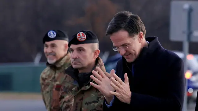 epa11786020 NATO Secretary General Mark Rutte (R) reacts during his visit to the military camp 'Novo Selo' in Bulgaria, 19 December 2024. NATO Secretary General Rutte paid a visit to the training center to address troops from the NATO Multinational Battle Group. EPA/VASSIL DONEV