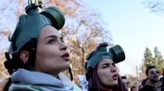 epaselect epa11795895 Women wearing gas masks shout slogans during a protest calling for measures to tackle air pollution in Skopje, Republic of North Macedonia, 28 December 2024. North Macedonia's capital Skopje is one of the most polluted cities in the world in winter time. EPA/GEORGI LICOVSKI